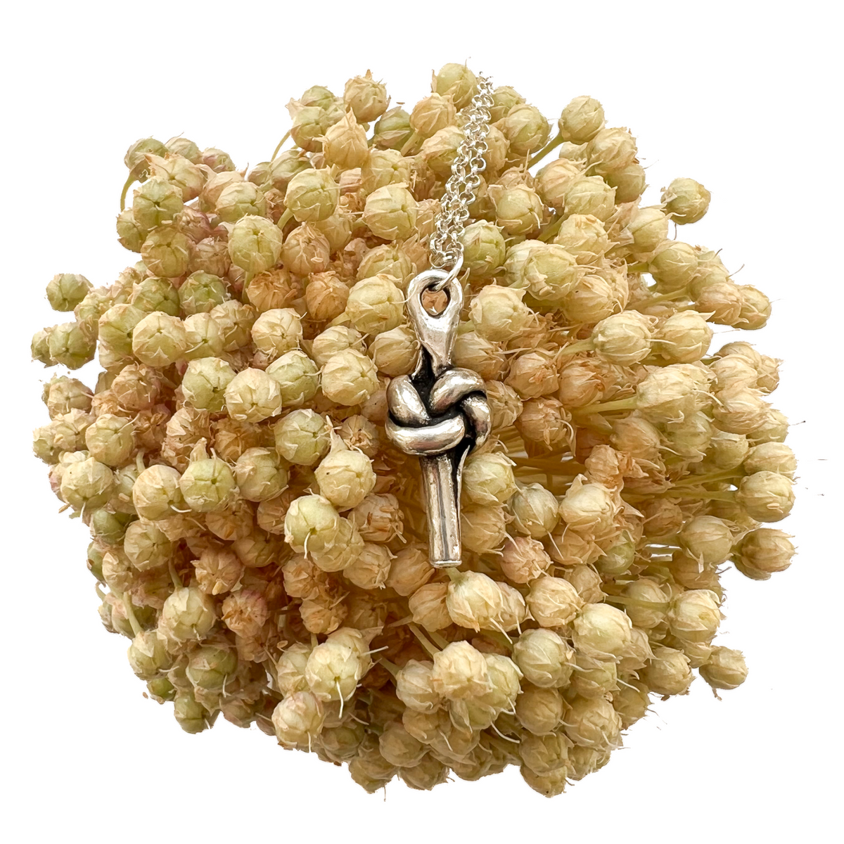 Pewter Love Knot pendant on allium flower