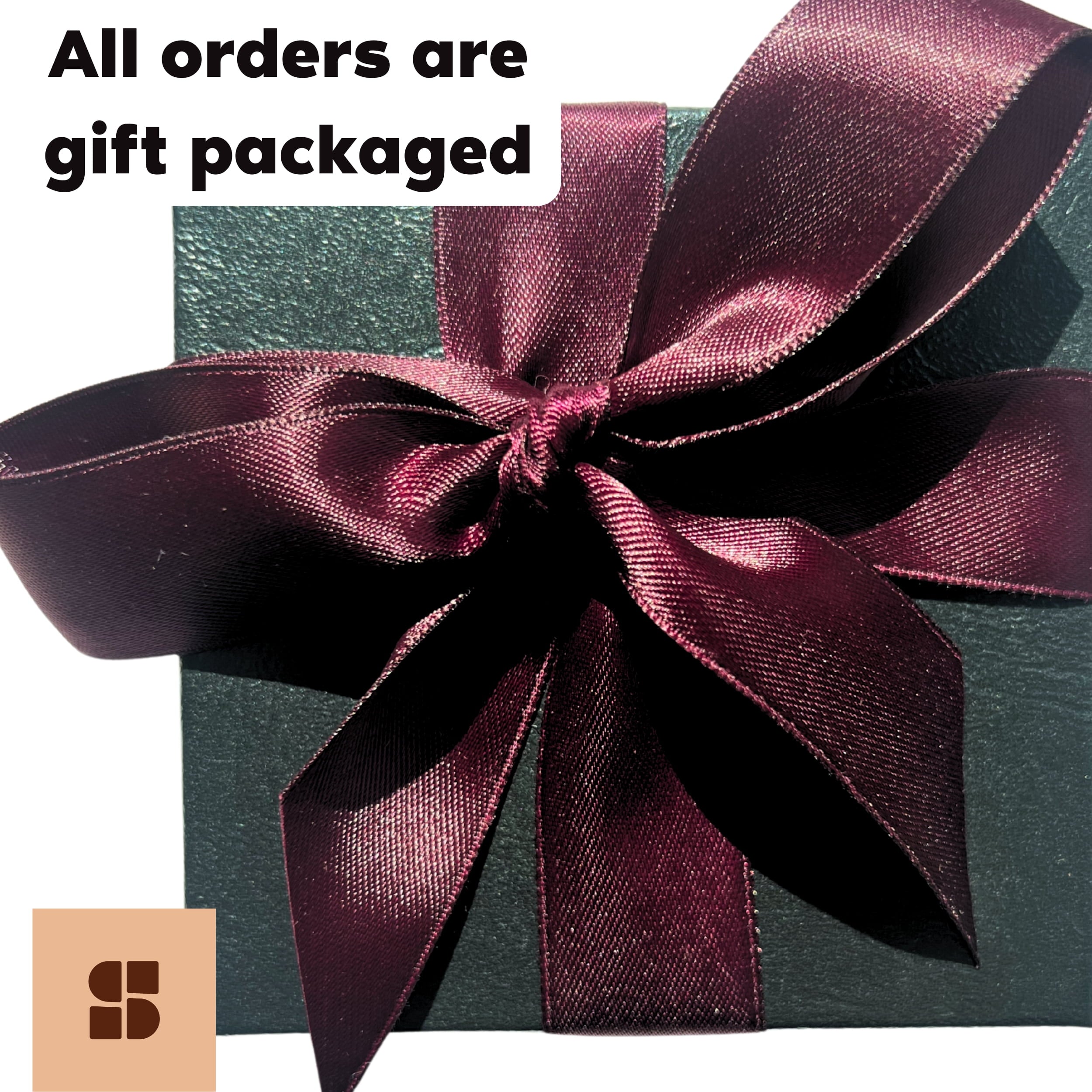 Gift box with a purple ribbon and text 'All orders are gift packaged' on a white background.