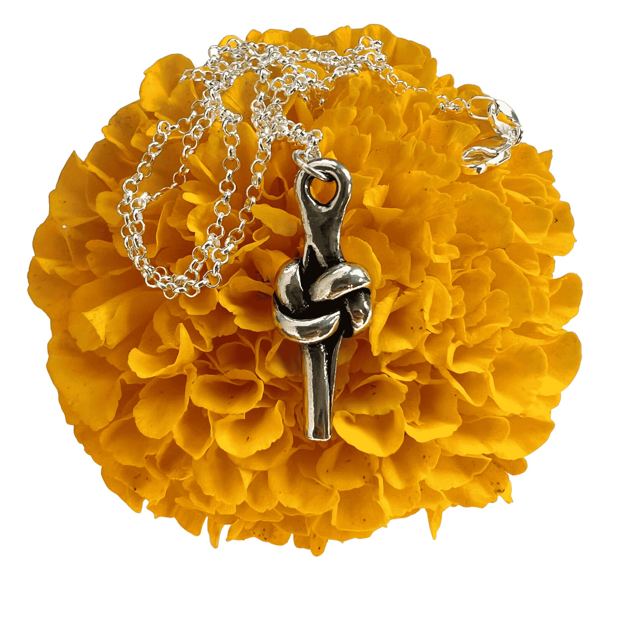 Pewter love knot pendant on a yellow marigold.