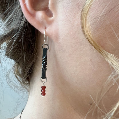garnet and iron twist earrings, 6th anniversary gift, iron anniversary gift for her, garnet steel dangles, blacksmith made